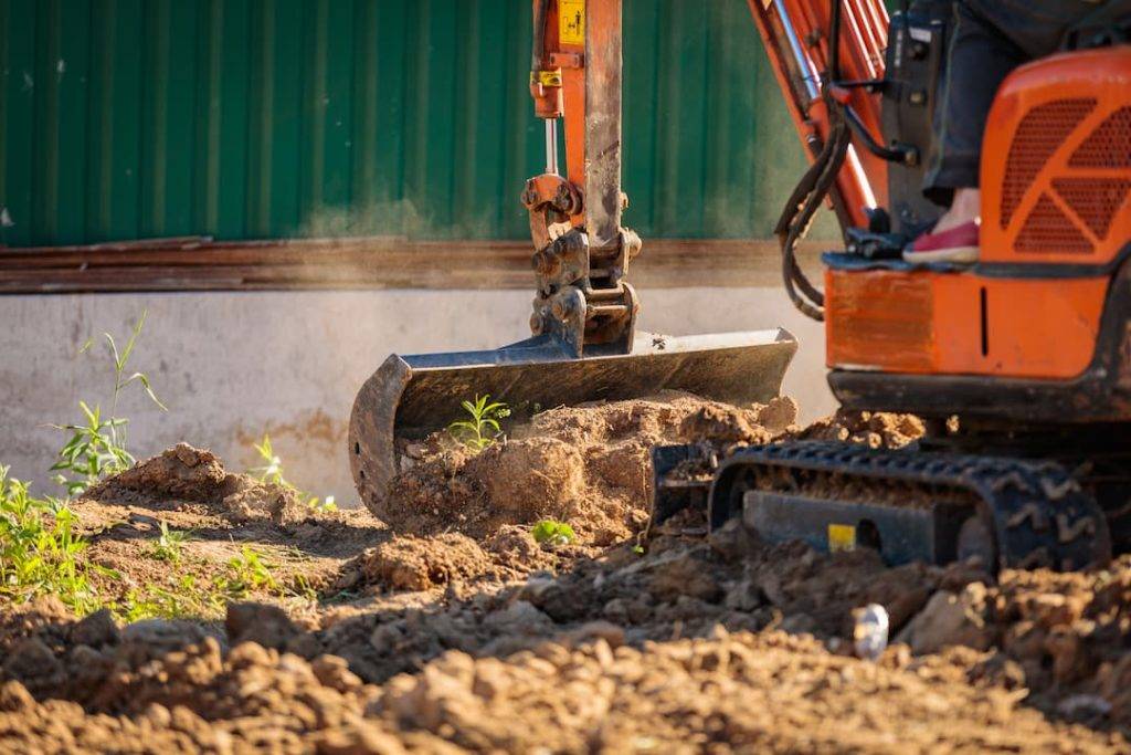 Orange Digger Digging Soil